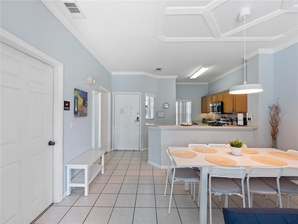 8517 Crystal Cove Loop Kissimmee, FL 34747 - Photo 11 of 20 a kitchen with stainless steel appliances kitchen island granite countertop a sink and cabinets