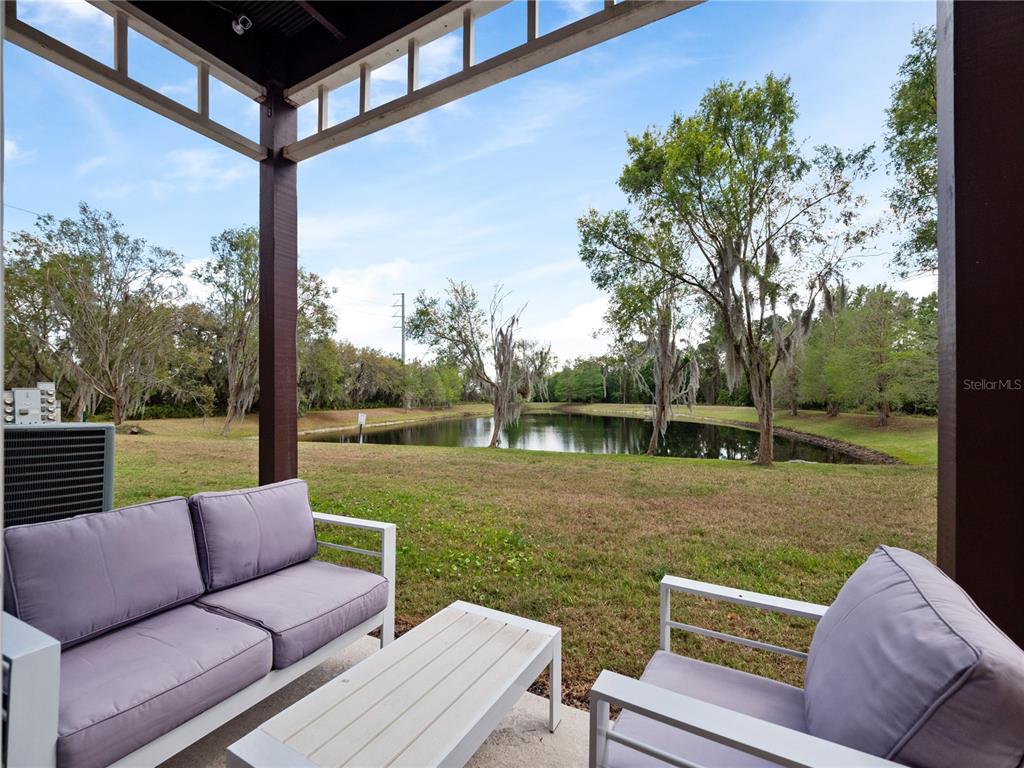 8517 Crystal Cove Loop Kissimmee, FL 34747 - Photo 3 of 20 a view of a patio with couches chairs and a yard
