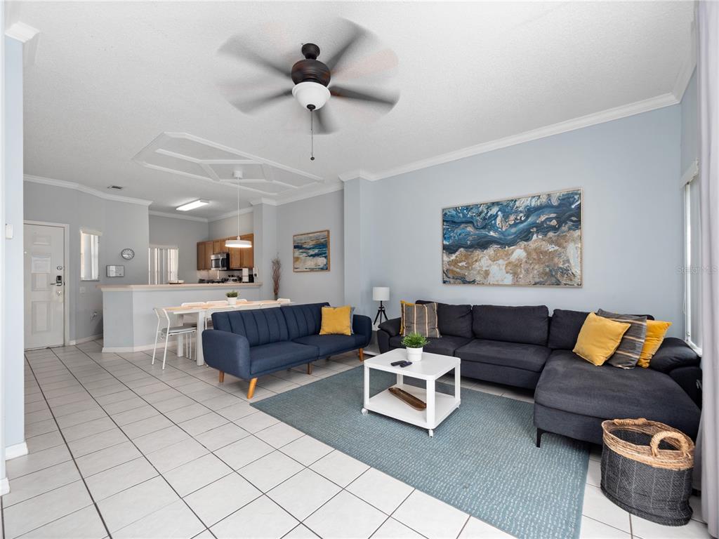 8517 Crystal Cove Loop Kissimmee, FL 34747 - Photo 4 of 20 a living room with furniture and a view of kitchen