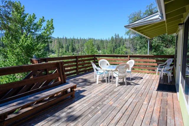 a bedroom with a bed and a dresser with mirror