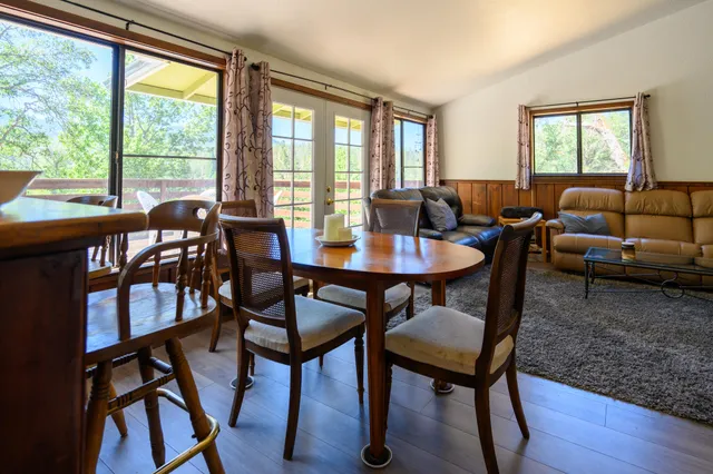 a kitchen with granite countertop wooden floors and appliances