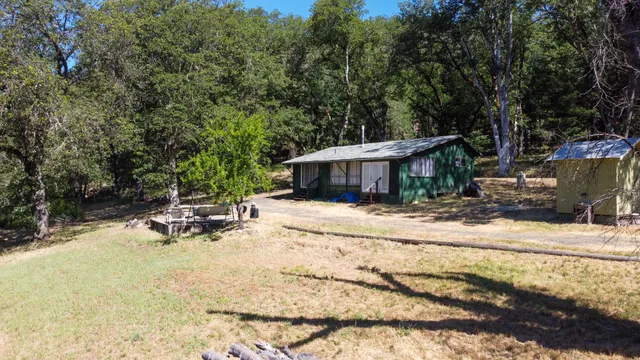 a view of a chairs and tables in the backyard
