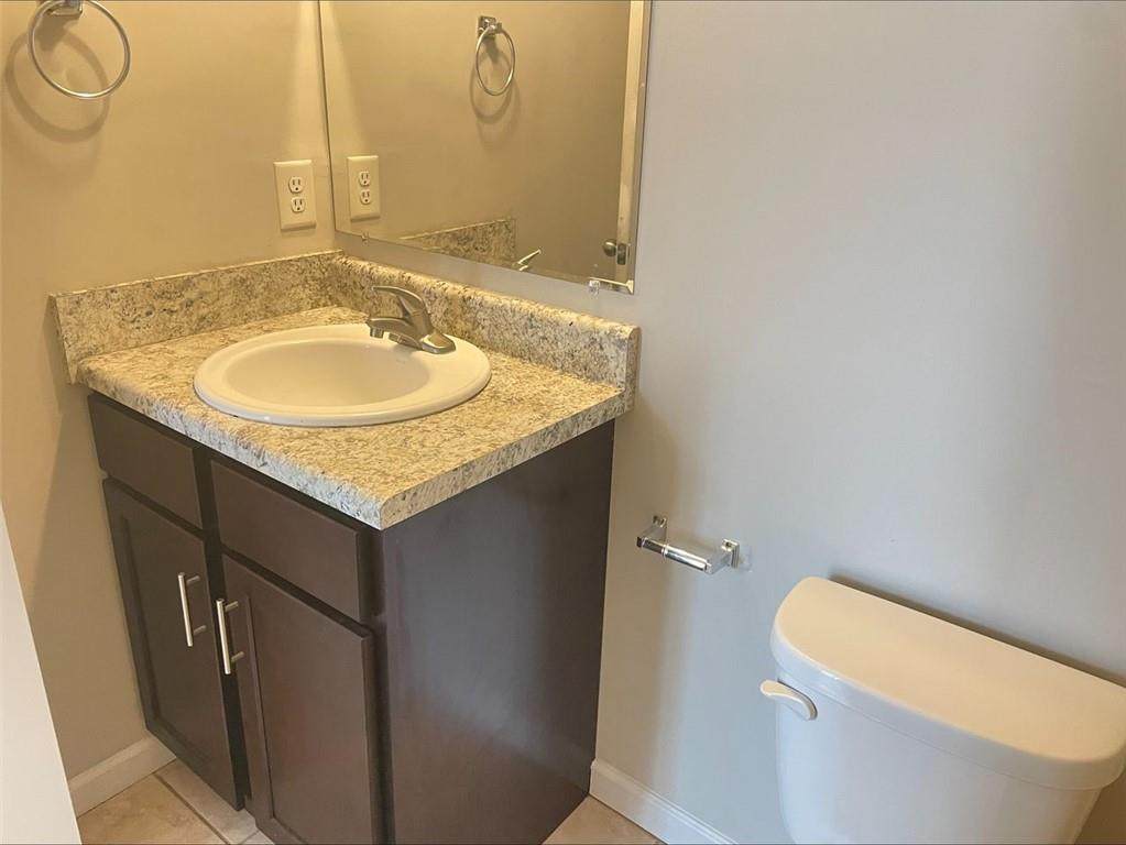 Undisclosed Address Norcross, GA 30093 - Photo 14 of 18 a bathroom with a granite countertop sink and a mirror