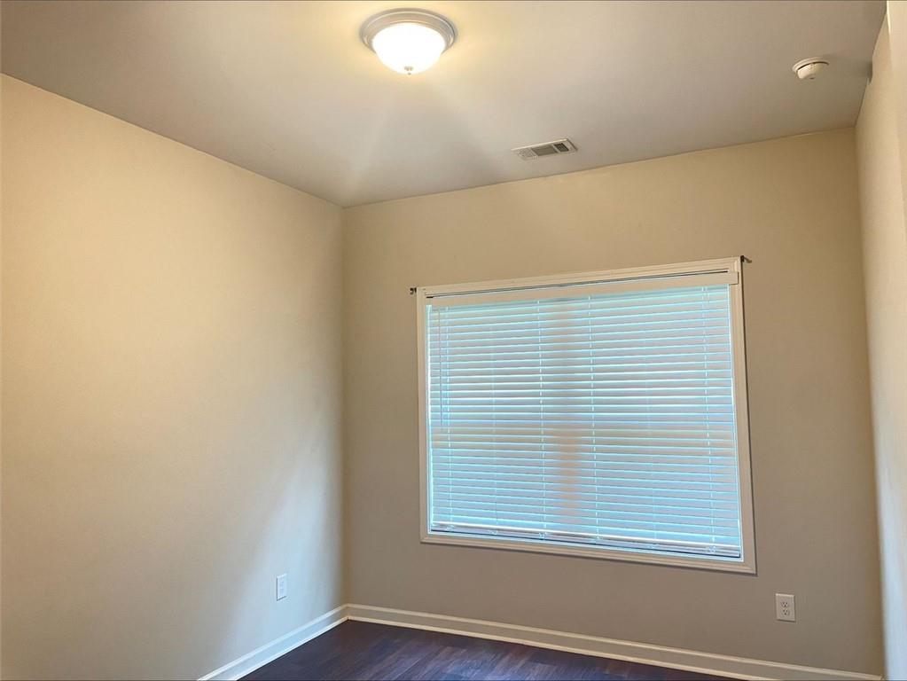 Undisclosed Address Norcross, GA 30093 - Photo 16 of 18 an empty room with wooden floor and windows
