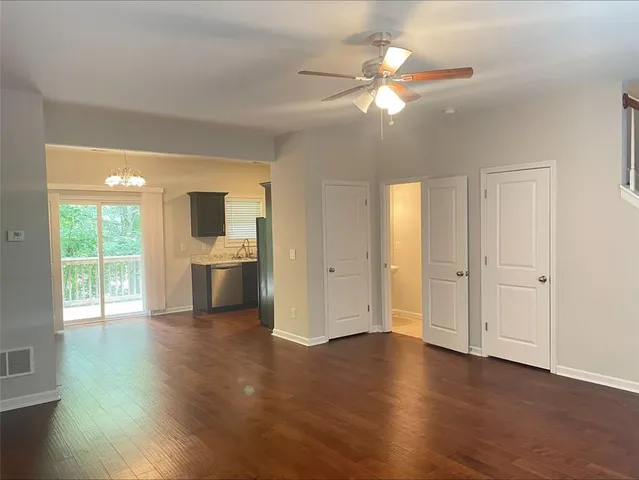 a view of a kitchen with a sink and a window