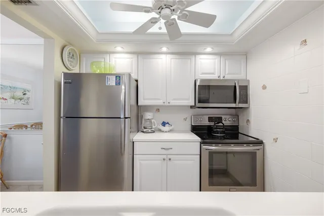a kitchen with a refrigerator and a sink