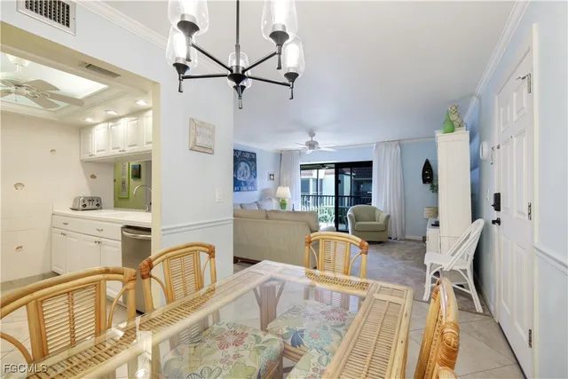 a view of a kitchen and dining table a sink
