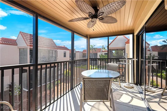 a view of a patio with a table chairs and a table