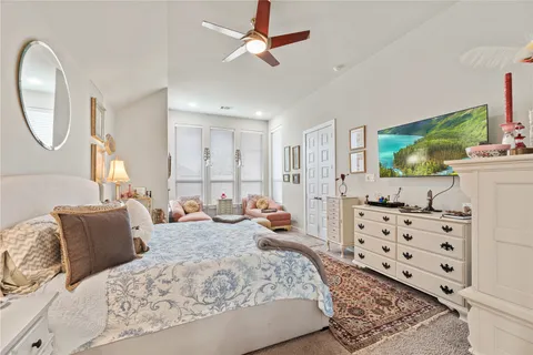 a bed room with bed and a television