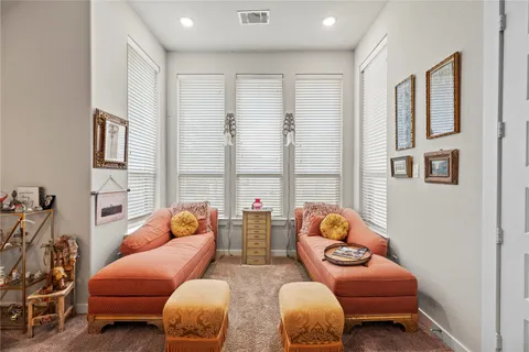a living room with furniture toys and a window