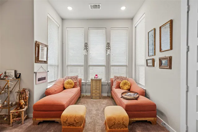 a living room with furniture toys and a window