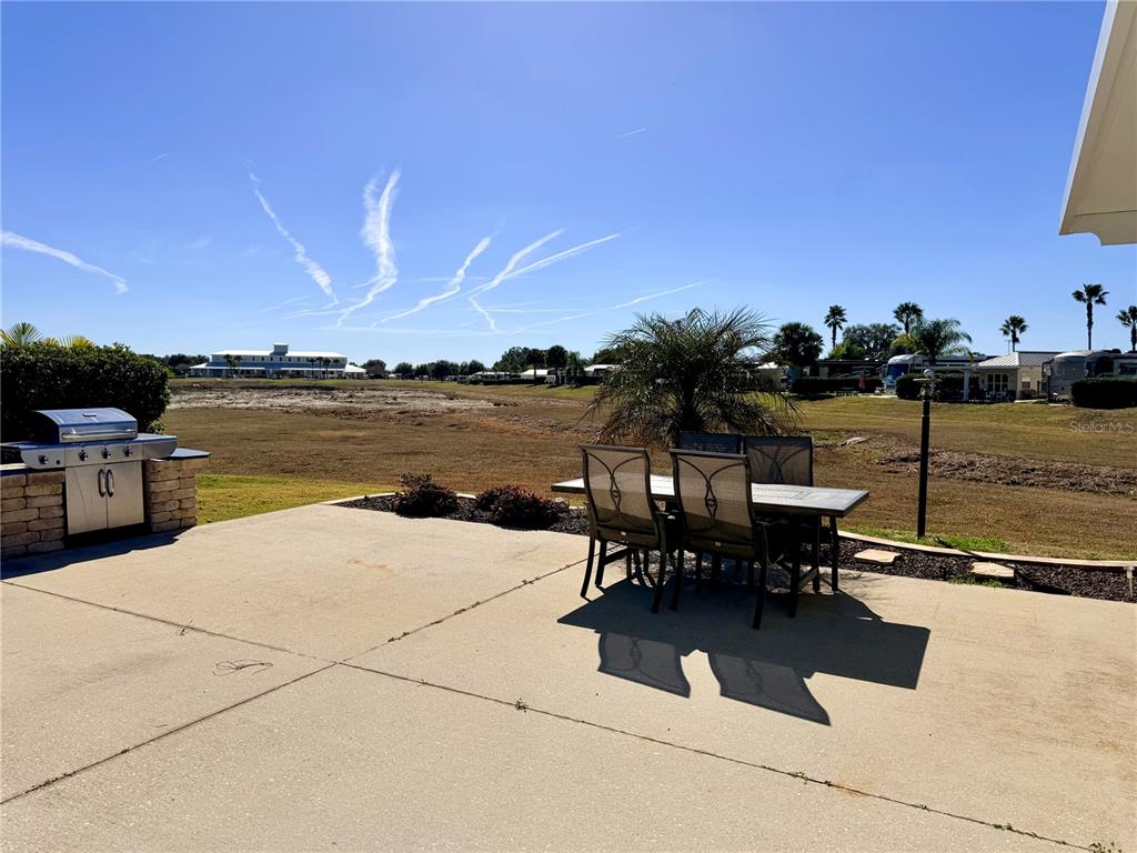 9404 Southeast 49th Terrace Webster, FL 33597 - Photo 6 of 42 a view of a terrace with chairs