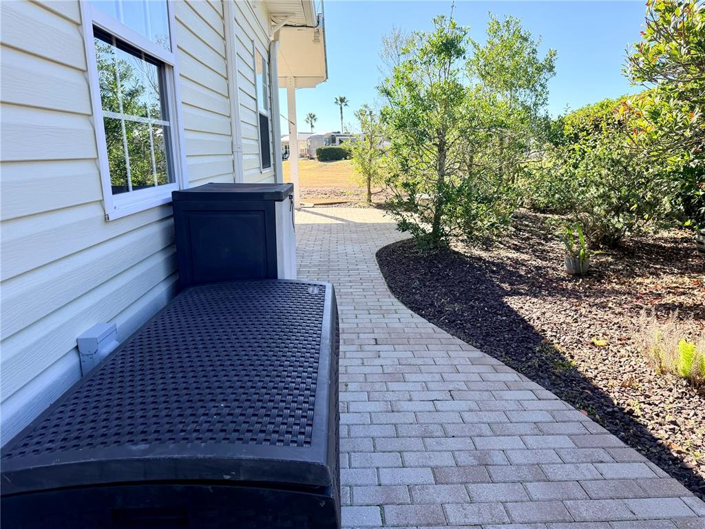 9404 Southeast 49th Terrace Webster, FL 33597 - Photo 9 of 42 a view of a pathway that has big trees