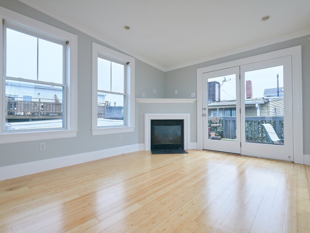 3 Leeds Street, Unit 3 Boston, MA 02127 - Photo 12 of 27 a view of an empty room with wooden floor and a window