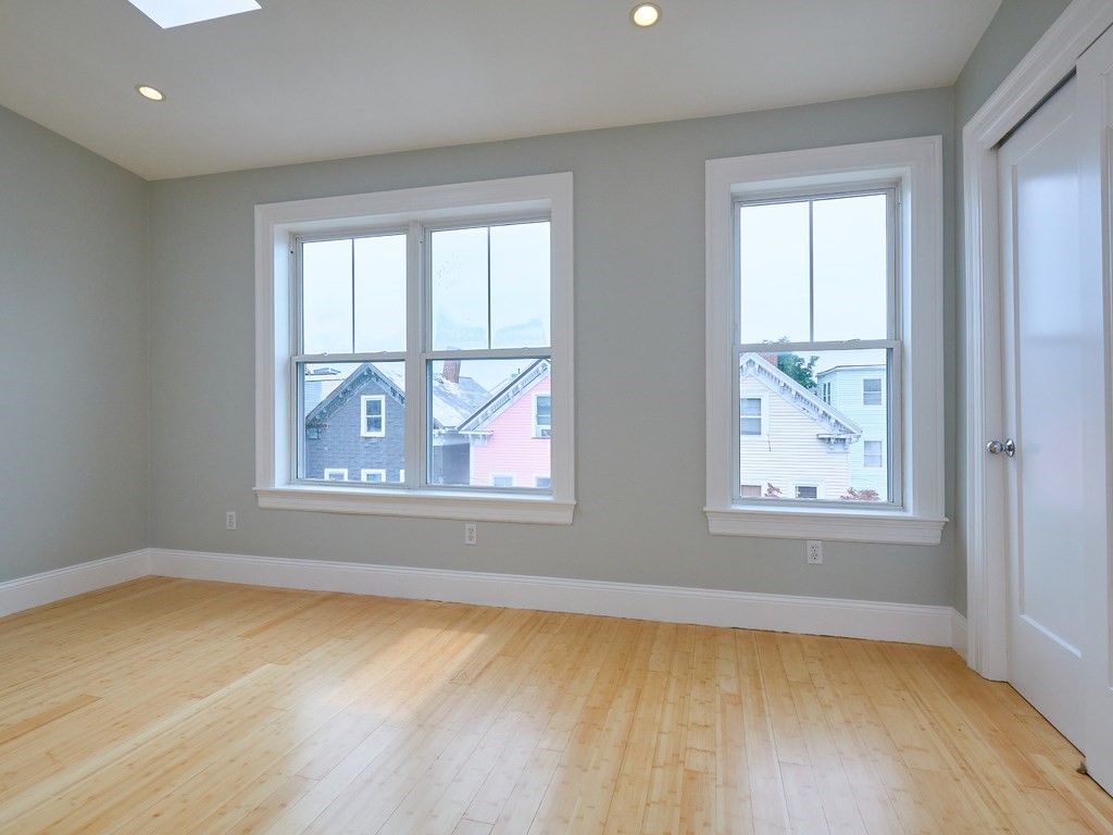 3 Leeds Street, Unit 3 Boston, MA 02127 - Photo 15 of 27 wooden floor in an empty room with a window