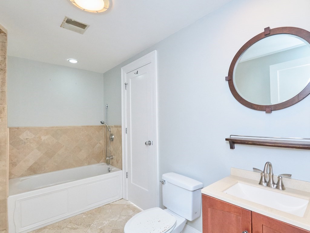 3 Leeds Street, Unit 3 Boston, MA 02127 - Photo 19 of 27 a bathroom with a sink a toilet and a mirror