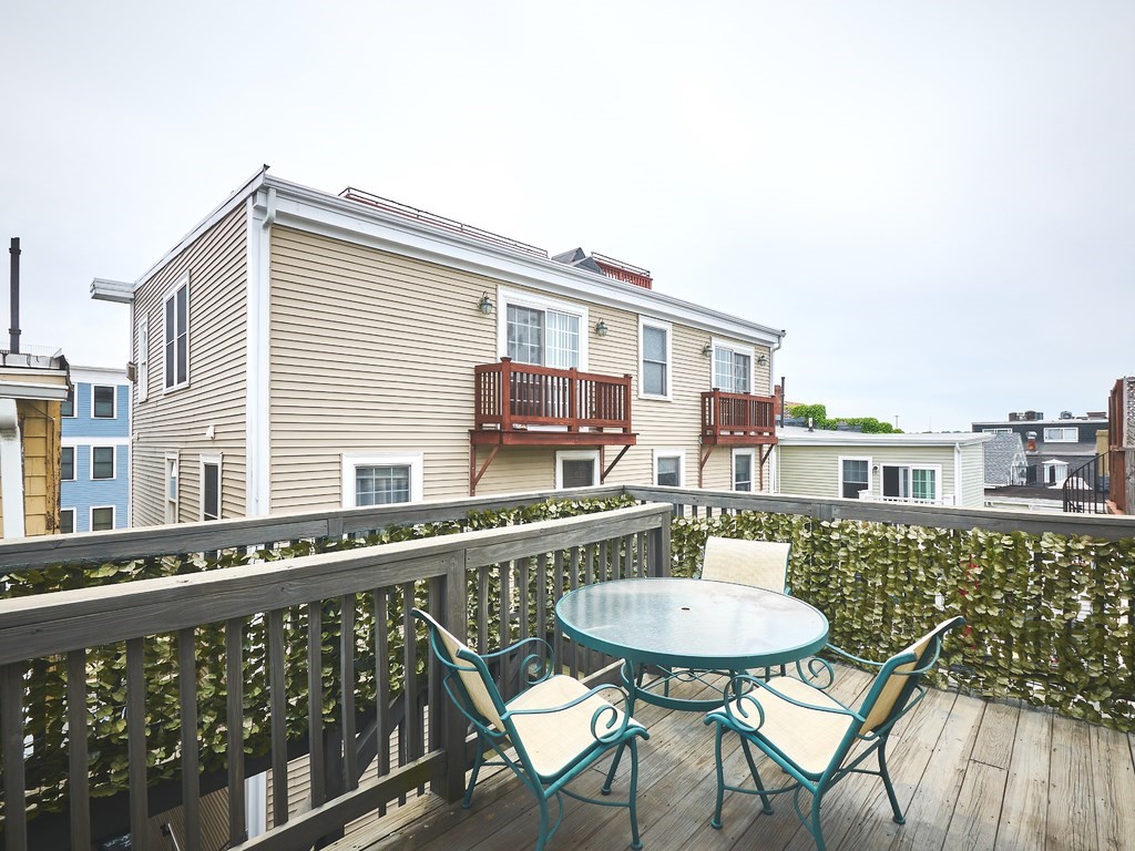3 Leeds Street, Unit 3 Boston, MA 02127 - Photo 21 of 27 a balcony with table and chairs