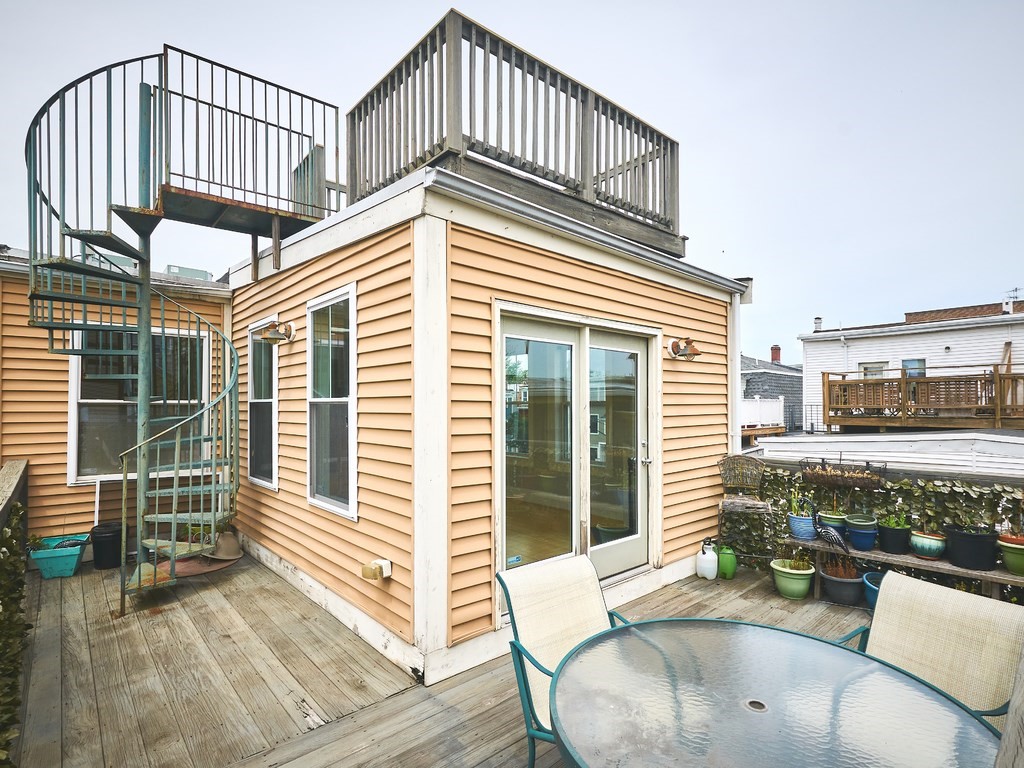 3 Leeds Street, Unit 3 Boston, MA 02127 - Photo 23 of 27 a view of a house with a deck