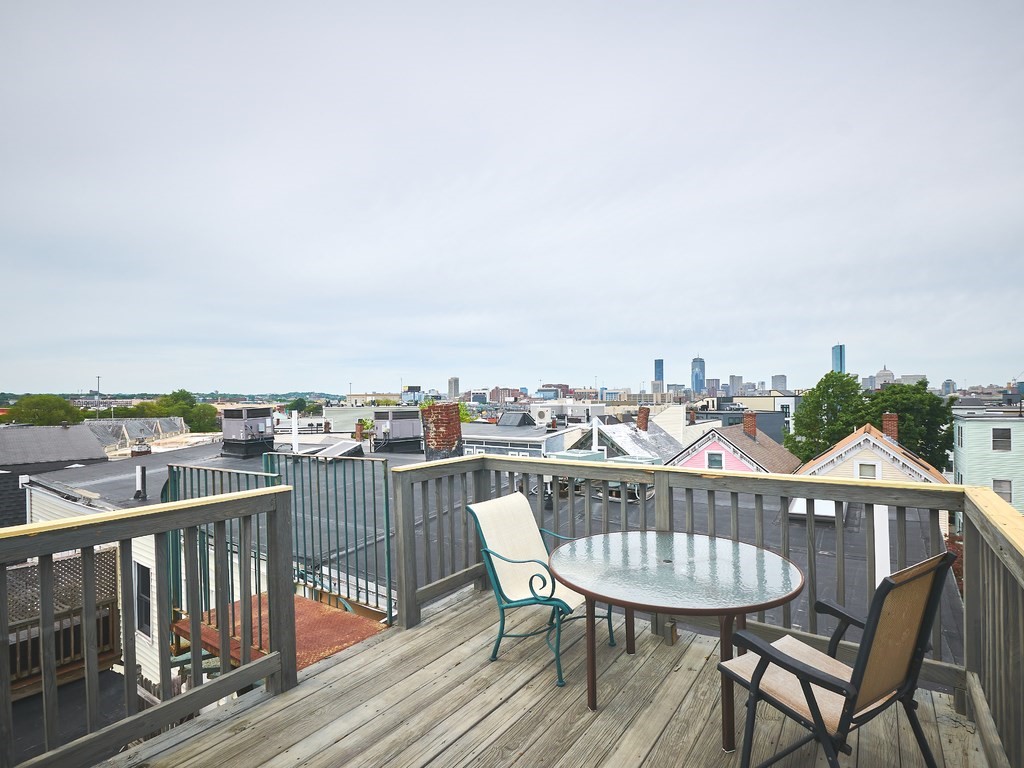 3 Leeds Street, Unit 3 Boston, MA 02127 - Photo 26 of 27 a view of a roof deck with chair and wooden floor
