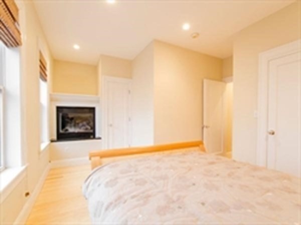 3 Leeds Street, Unit 3 Boston, MA 02127 - Photo 8 of 27 a view of an empty room with a fireplace