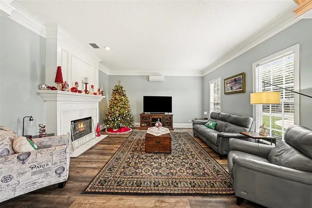 a living room with furniture fireplace and window