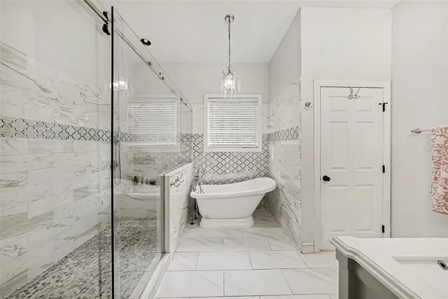 a bathroom with a toilet sink and shower