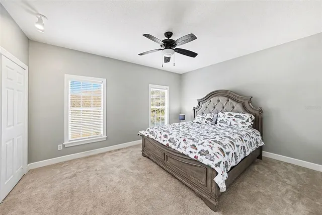 a bedroom with a bed and window