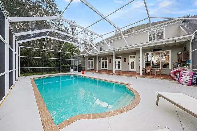 a view of a swimming pool with a patio