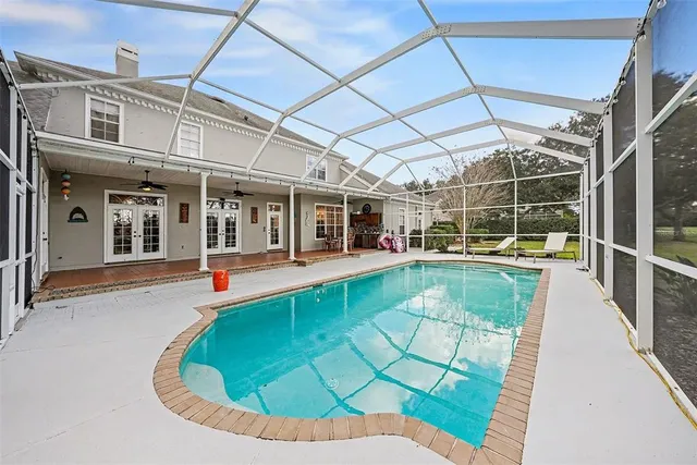 a view of a swimming pool with a patio