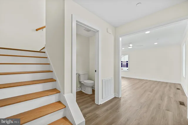 a view of entryway with stairs and wooden floor