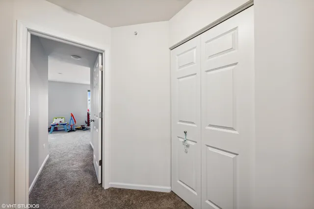 a view of a hallway to closet and a yard