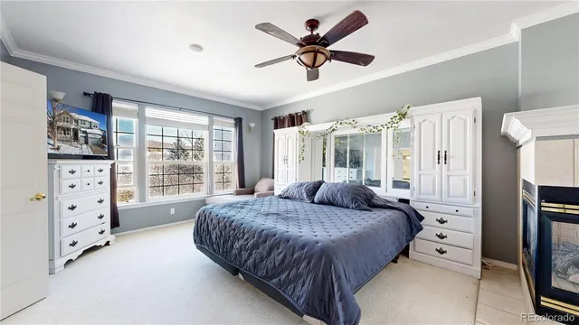 a view of an empty room with wooden floor and a bathroom
