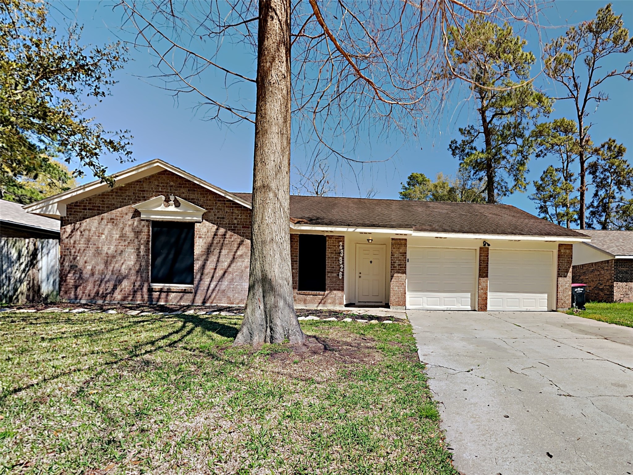 23926 Spring Day Lane Spring, TX 77373 - Photo 1 of 19 a view of a house with a yard