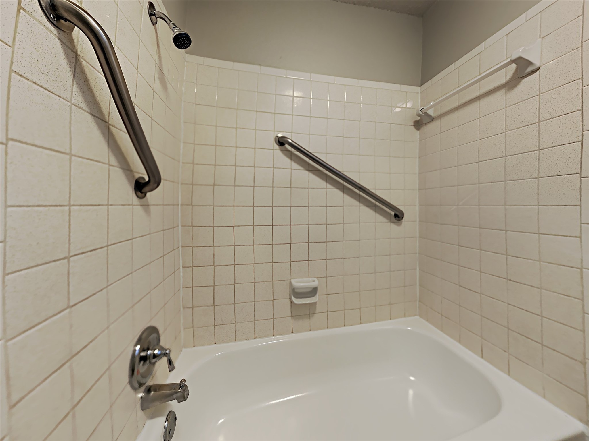 23926 Spring Day Lane Spring, TX 77373 - Photo 17 of 19 a bathroom with a bathtub