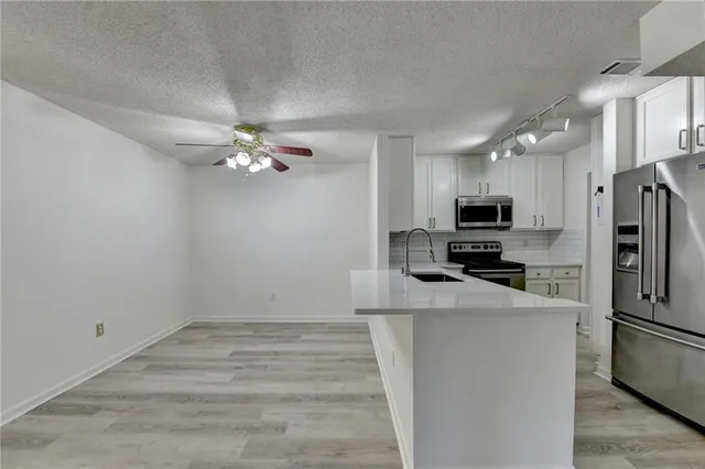 an aerial view of a house with outdoor space
