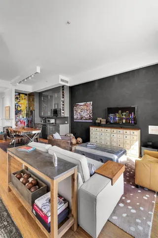 a bedroom with a bed and a table