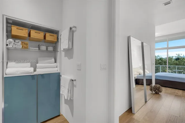 a bathroom with a sink a mirror and shower