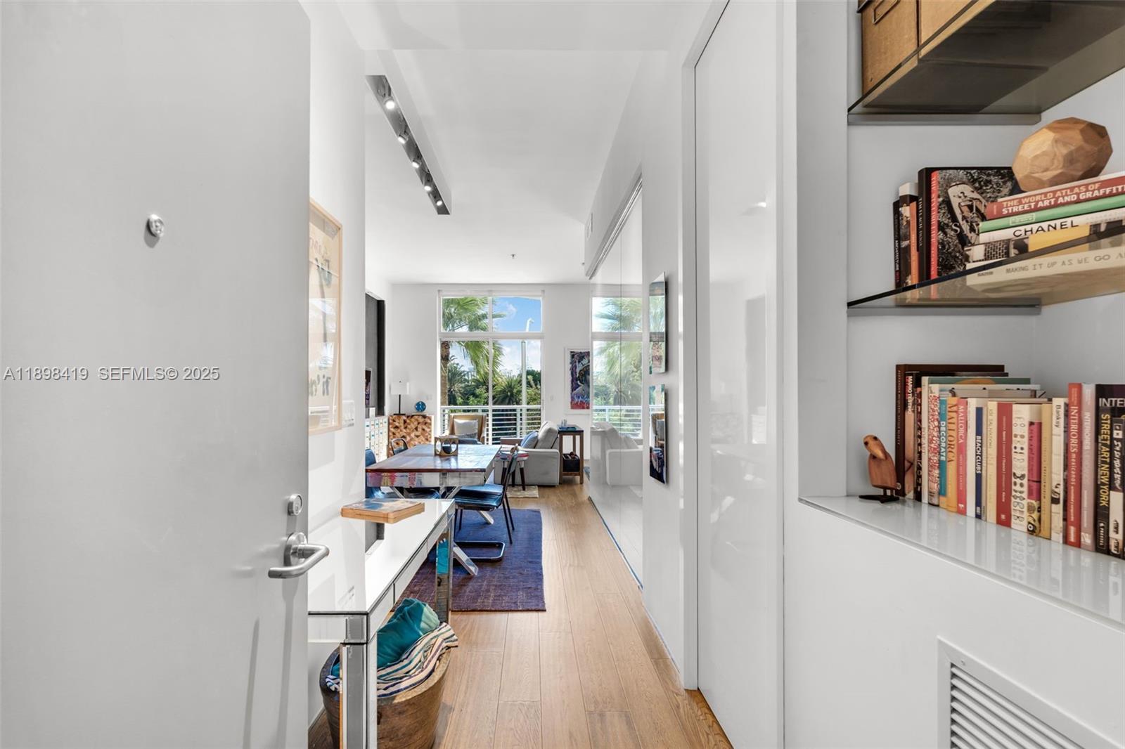 2001 Meridian Avenue, Unit 404 Miami Beach, FL 33139 - Photo 4 of 46 a very nice looking room with many windows and furniture