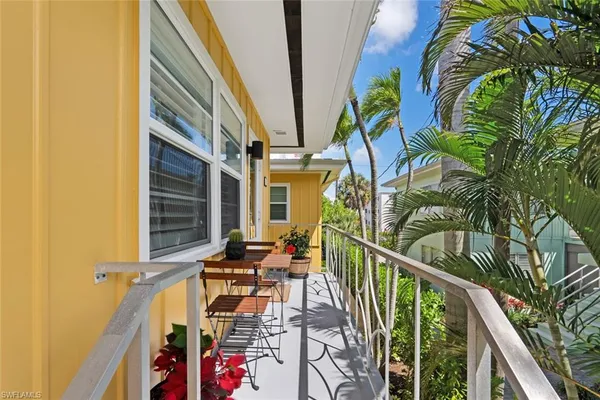 a view of balcony and wooden floor