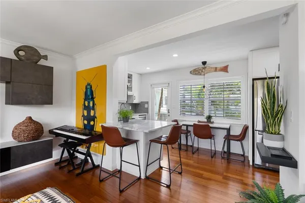 a view of a livingroom with furniture and a window
