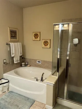 a bathroom with a tub and a sink