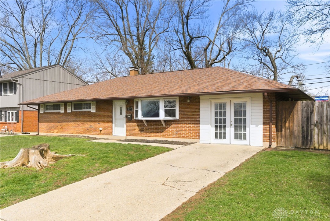 5171 Fishburg Road Dayton, OH 45424 - Photo 5 of 35 This charming residence features a classic brick exterior and a welcoming facade, offering inviting curb appeal.