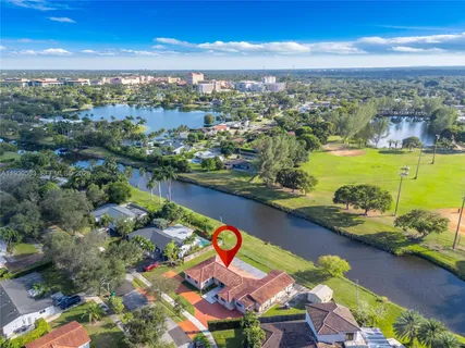 an aerial view of residential houses with outdoor space