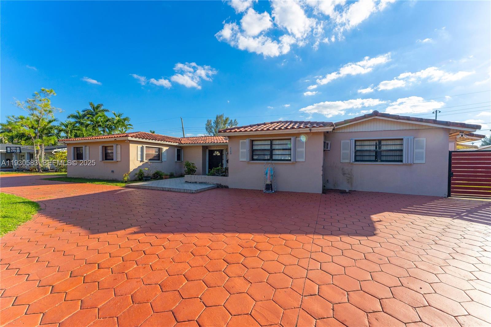 9380 Southwest 83rd Street Miami, FL 33173 - Photo 3 of 8 a view of a house with a patio