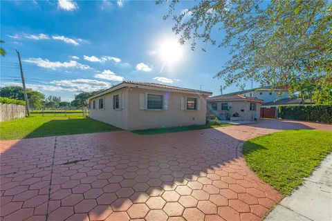 a view of a lake with houses in the back