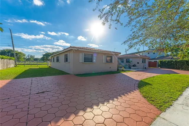 a view of a lake with houses in the back