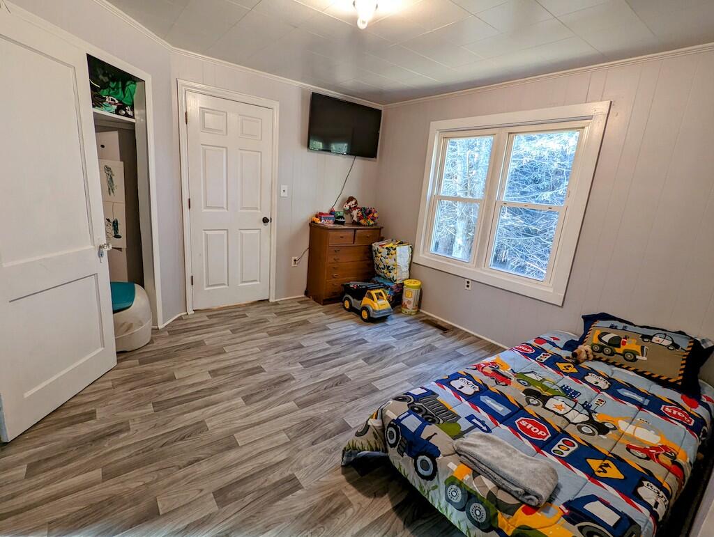 825 Macks Mountain Road Northwest Indian Valley, VA 24105 - Photo 11 of 30 a bed room with a bed and a window