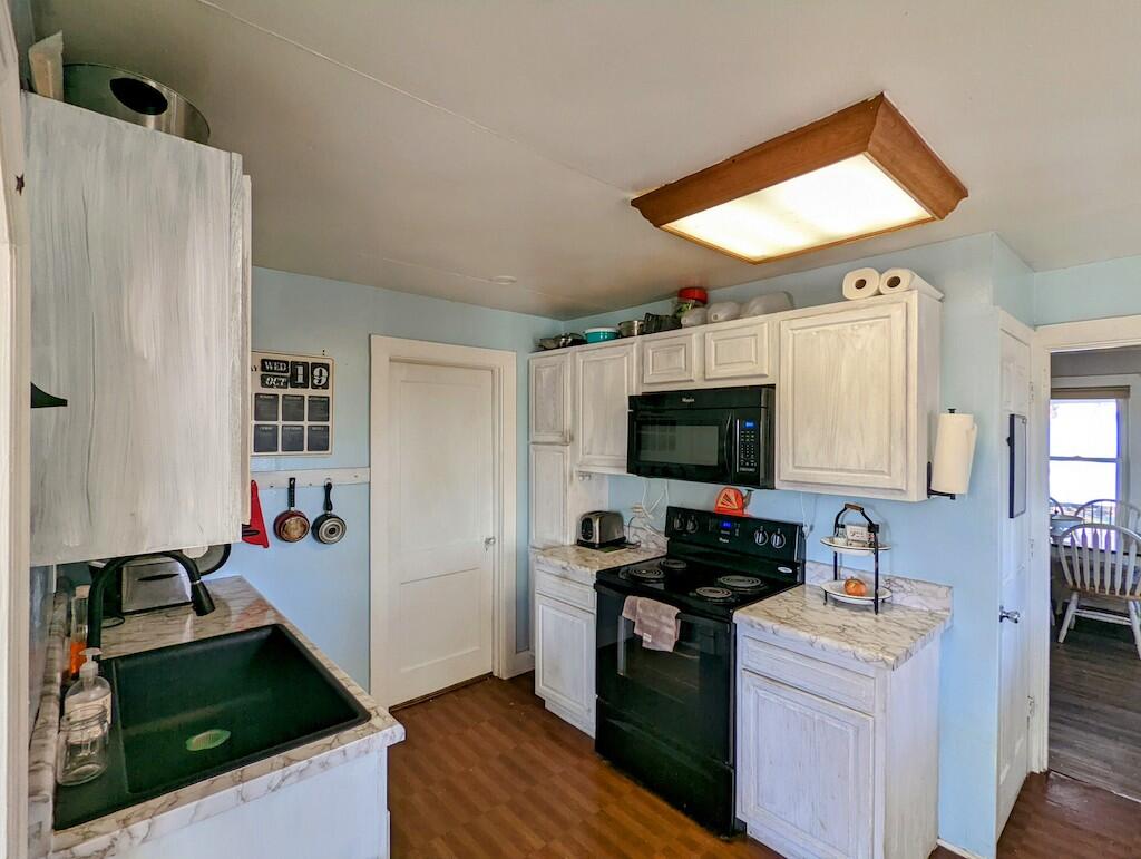 825 Macks Mountain Road Northwest Indian Valley, VA 24105 - Photo 13 of 30 a kitchen with a refrigerator and a stove top oven