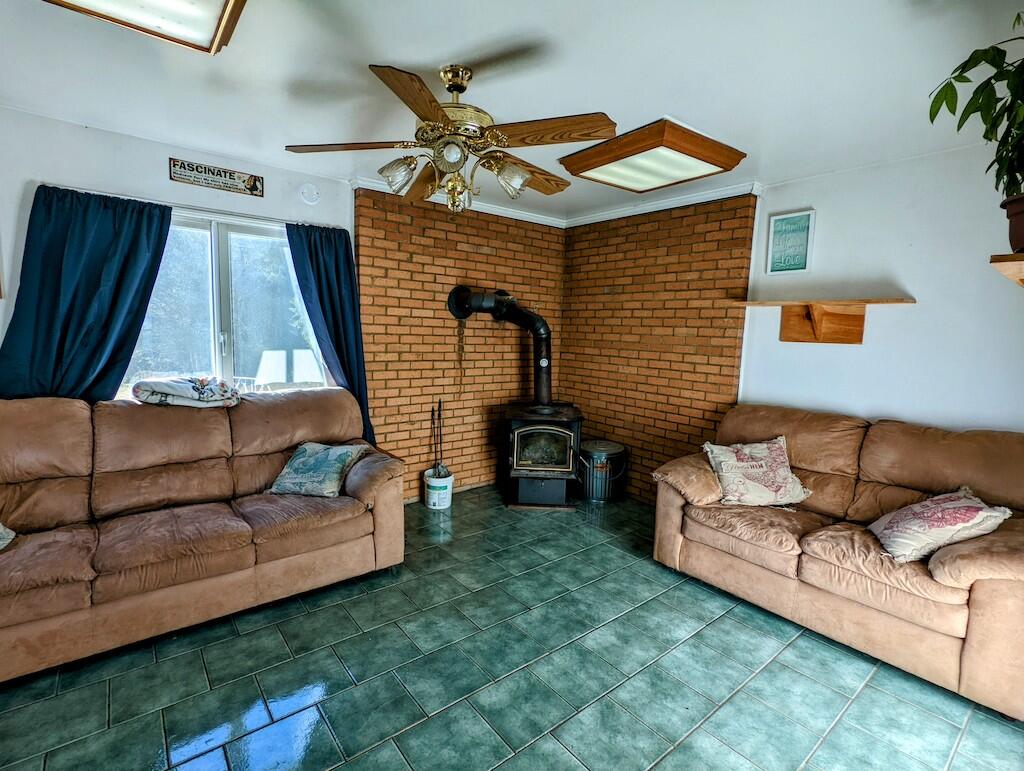 825 Macks Mountain Road Northwest Indian Valley, VA 24105 - Photo 16 of 30 a living room with furniture and a yard