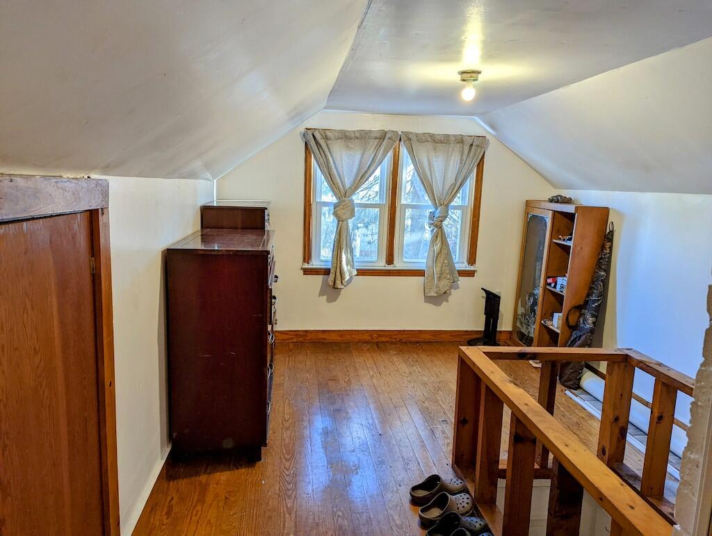 825 Macks Mountain Road Northwest Indian Valley, VA 24105 - Photo 20 of 30 a view of a hallway with wooden floor and staircase